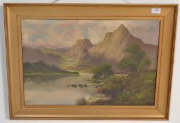 A 19th century oil on canvas painting of a highland  loch scene with mountains to the foreground