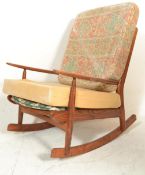 A retro 20th Century Scandart oak framed rocking chair / armchair being raised on sleigh runners