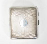 An early 20th Century silver hallmarked William Neale & Son cigarette case having engine turned