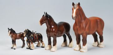 A group of Beswick ceramic horses to include a mat