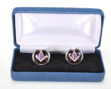 A pair of silver cufflinks having enamelled panels with masonic symbols. Stamped 925 silver. Gross