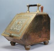 A 19th Century Victorian Aesthetic movement brass coal scuttle, carry handle to top with decorated