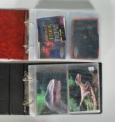 Two albums of trade cards to include Star Trek lenticular postcards ' Women of Star Trek ', Gil