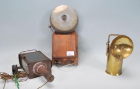A vintage 20th century Industrial alarm bell together with a brass lamp of cylindrical form and a