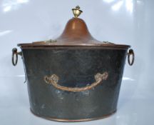 A 19th Century copper coal scuttle having brass sw