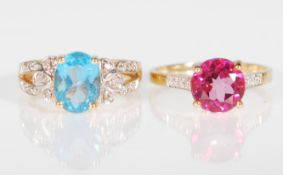 Two hallmarked 9ct gold rings. A blue topaz and diamond ring having a central oval mixed cut blue