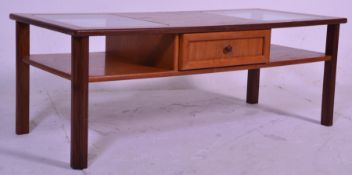 A retro mid 20th Century teak wood coffee table of rectangular form having twin inset glass panels