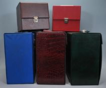 A group of three vintage / retro record LP vinyl carry cases, one in green another in blue and a
