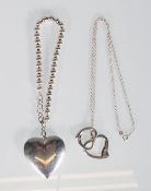 A selection of silver jewellery to include a heart pendant on a necklace chain marked Tiffany and co