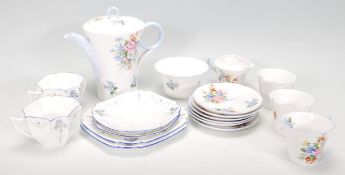 A mid 20th Century Shelley porcelain part coffee service painted with floral sprays having shaped