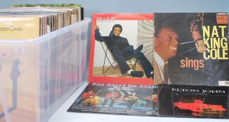 A selection of mixed Vinyl long play LP vinyl record albums to included artists Elton John, The