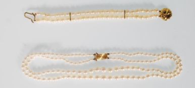 A modern pearl necklace with a 9ct gold pendant in the shape of a shell together with a matching