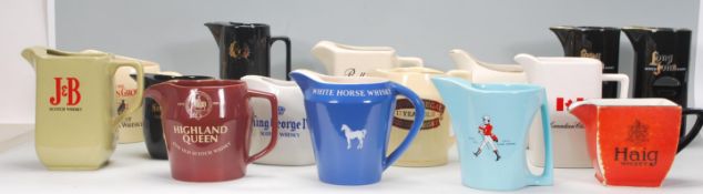A collection of vintage advertising ceramic whiskey jugs to include Bell's, Chivas, Ballantines,