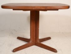 A vintage retro mid 20th Century teak wood extending dining table of square rounded edge form,
