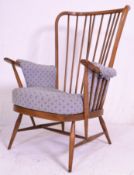A vintage retro 20th Century Ercol golden dawn spindle back armchair having turned splayed legs