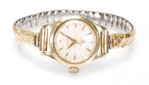 A vintage Omega seamaster ladies wrist watch having a round face with white enamelled dial and