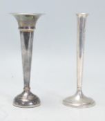 Two silver tulip / spill vases. One having a flared top with both of tapering form raised on round