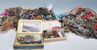 A large collection of costume jewellery to include necklaces, chains, bracelets, watches, beads,