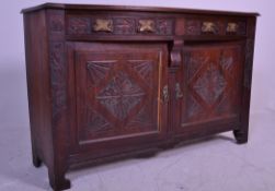 An Edwardian walnut Art Nouveau dresser base. Raised on stile legs with double doors over