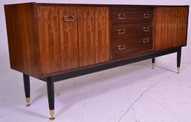 A mid 20th Century G-Plan Librenza model sideboard / credenza, having a central bank of three