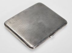 A silver hallmarked S Blanckensee & Son cigarette case having engine turned decoration to the