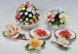 A group of vintage 20th Century Capodimonte ceramic flower ornaments of varying colours, two
