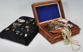 A collection of vintage and latter costume jewellery to include multiple pairs of earrings, rings,
