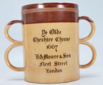 A 19th Century Victorian Doulton Lambeth stoneware loving cup having two graduating sets of twin