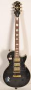 A Gibson Epiphone electric guitar 'Black Beauty' Les Paul solid body. The black body having white