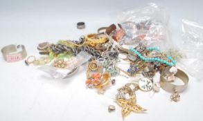A collection of vintage costume jewellery to include necklaces, bracelets, brooches, rings, faux