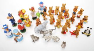 A small collection of miniature cold painted metal figures to include multiple bears doing various