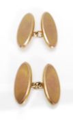 A pair of hallmarked 9ct gold cufflinks having oval panels united by chain links. Hallmarked
