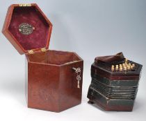 An early 20th Century Lachenal & Co concertina squeeze box of hexagonal form having pierced