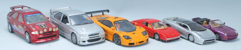 A collection of 1/18 & 1/24 diecast model toy cars comprising of a UT Models 1/18 Ford Escort, UT