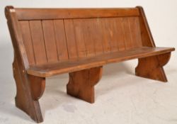 A Victorian 19th century Gothic Arts & Crafts solid oak pew bench of ecclesiastical form being