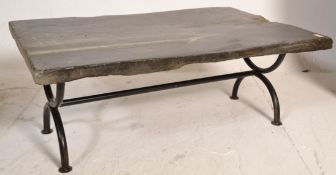 A good vintage retro 20th Century slate topped coffee table raised on a curved X frame style tubular