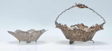 Two 20th Century silver white metal filigree dishes to include one in the form of a basket of
