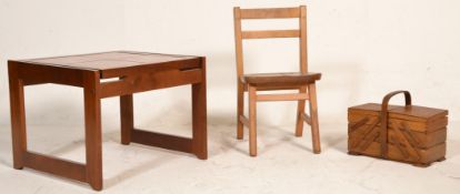 A retro mid century beech wood metamorphic opening sewing box together with an early 20th century