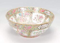 A 19th Century Canton Chinese centrepiece bowl having famille rose enamelled detailing with