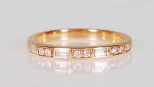 A good 18k yellow gold ladies ring set with seven square and round cut diamonds of approx 30pts.