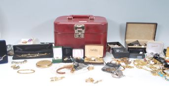 A collection of vintage costume jewellery to include a three strand simulated pearl necklace, yellow