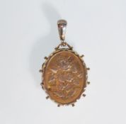 A silver hallmarked 19th Century Victorian locket of oval form having engraved floral decoration,