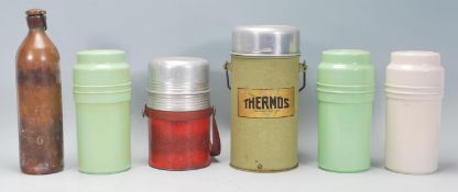 A mixed group of five vintage 20th Century Thermoses in varying sizes and colours to include three