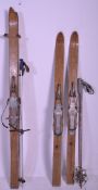 A pair of vintage 1940's Lillywhites ski's of bent