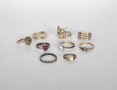 A selection of silver rings to include a marcasite dress ring, a white stone solitaire ring, a twist