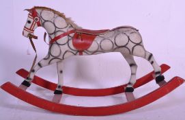 A good vintage 20th Century wooden ande papier mache dapple grey rocking horse having a short hair