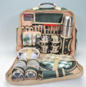 A late 20th century four person Concept picnic hamper, contains, cups ,plates , forks, knife,