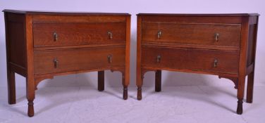A 1920's pair of oak chest of drawers raised on squared legs with a bank of drawers having