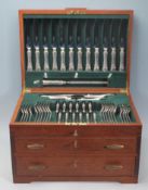 A 20th Century teak wood cutlery canteen with three drawers each having keys being fully appointed