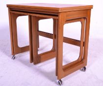 A 20th Century retro teak wood nest of three table